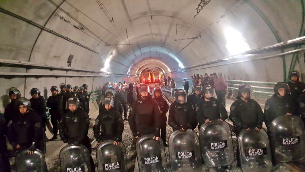 Entire subway system paralysed in protest as police detain 16 workers